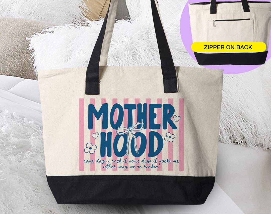 "Motherhood Some Days I Rock It" design on a natural canvas zippered tote bag