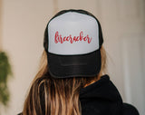 "Firecracker" design on a mesh-back snapback trucker hat