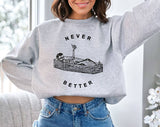 "Never Better Funny Skeleton Coffin" design on an ash gray unisex crewneck sweatshirt