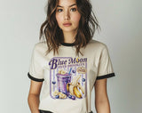 "Blue Moon Over Brooklyn Heated Rivalry" design on a natural ringer t-shirt with black contrast trim