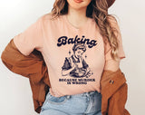 "Baking Because Murder Is Wrong" design on a peach unisex t-shirt