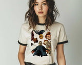 "Horror Icons Looking Down" design on a natural ringer t-shirt with black contrast trim