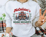 "McCallister's Home Security" design on an ash gray unisex crewneck sweatshirt