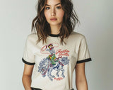 "Rootin Tootin Cowgirl" design on a natural ringer t-shirt with black contrast trim
