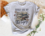 "Books Are My Therapy Flowers" design on a heather gray unisex t-shirt