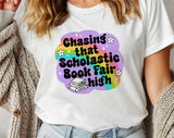 "Chasing That Scholastic Book Fair High" design on a white unisex t-shirt