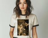 "Cat Getting Tattoo Meme" design on a natural ringer t-shirt with black contrast trim
