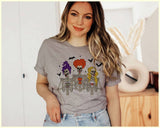 "Sanderson Coffee Skeletons" design on a heather gray unisex t-shirt