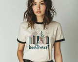 "Booktrovert" design on a natural ringer t-shirt with black contrast trim