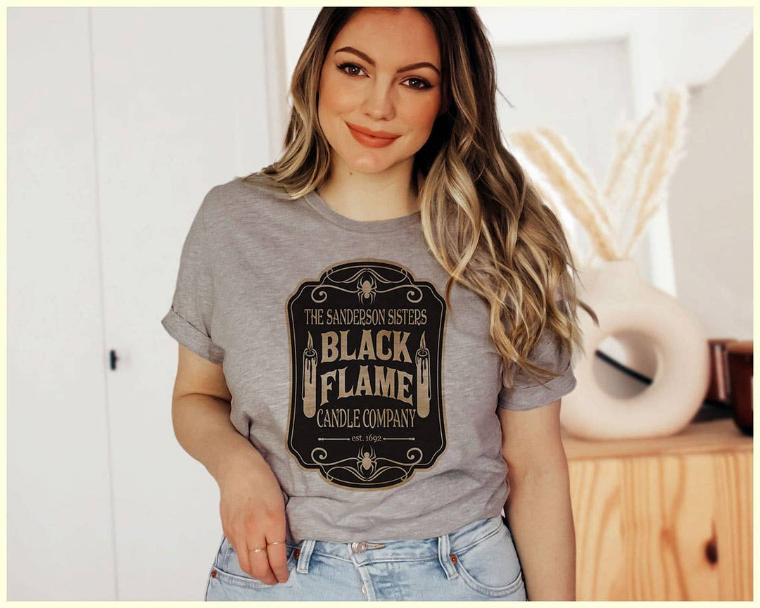 "The Black Flame Candle" design on a unisex t-shirt