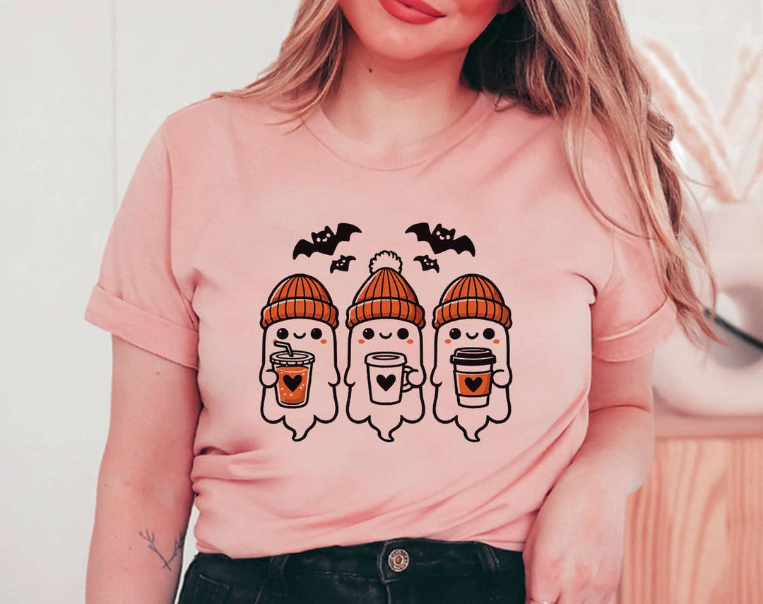 "Three Ghosts Drinking Coffee" design on a peach unisex t-shirt