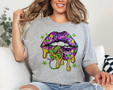 "Mardi Gras Lips Beads Stars" design on a heather gray unisex t-shirt