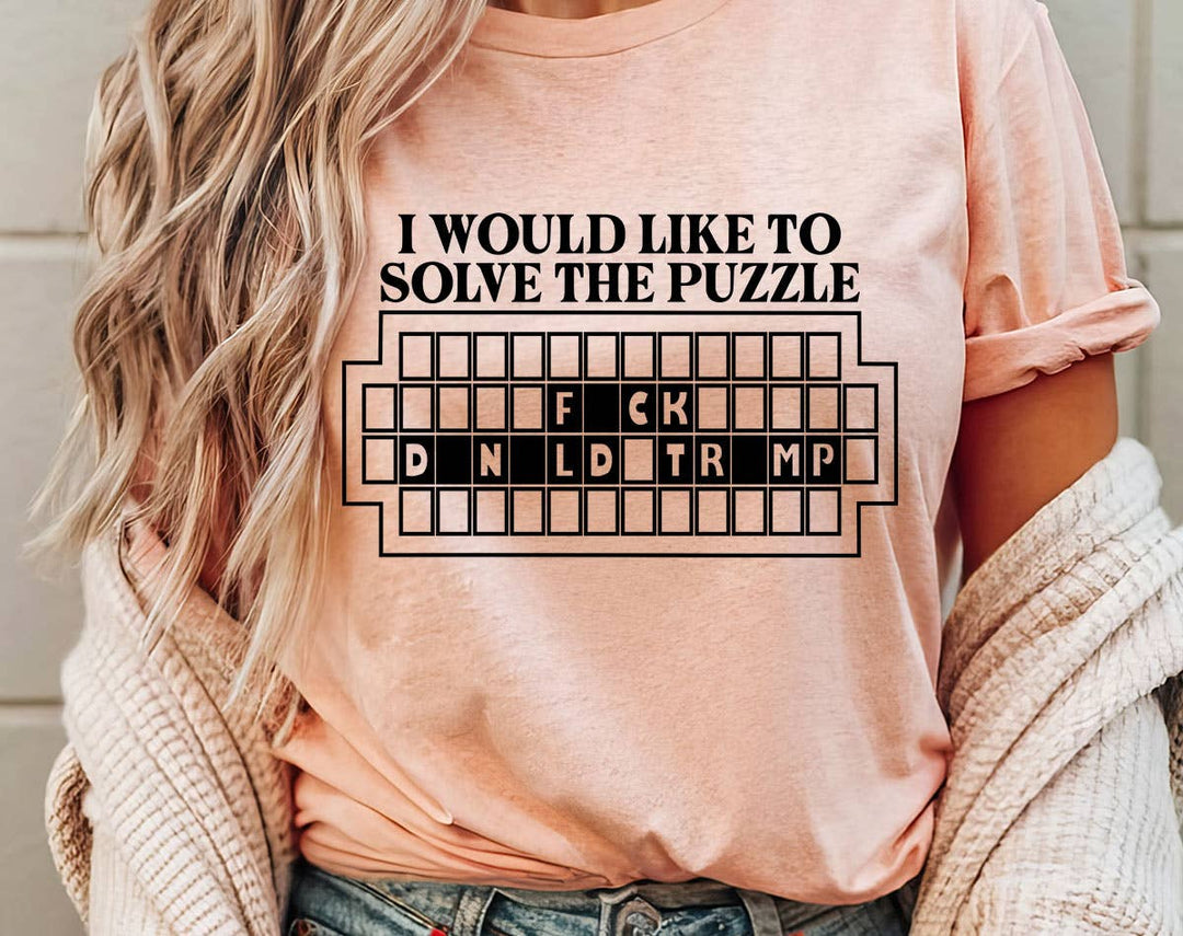 "Solve The Puzzle F*ck Trump" design on a peach unisex t-shirt