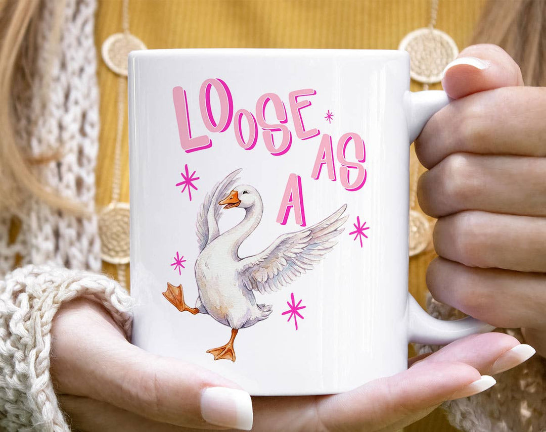 "Loose As A" design on a white ceramic coffee mug