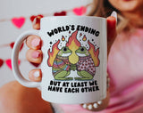 "Worlds Ending Frog Love" design on a white ceramic coffee mug