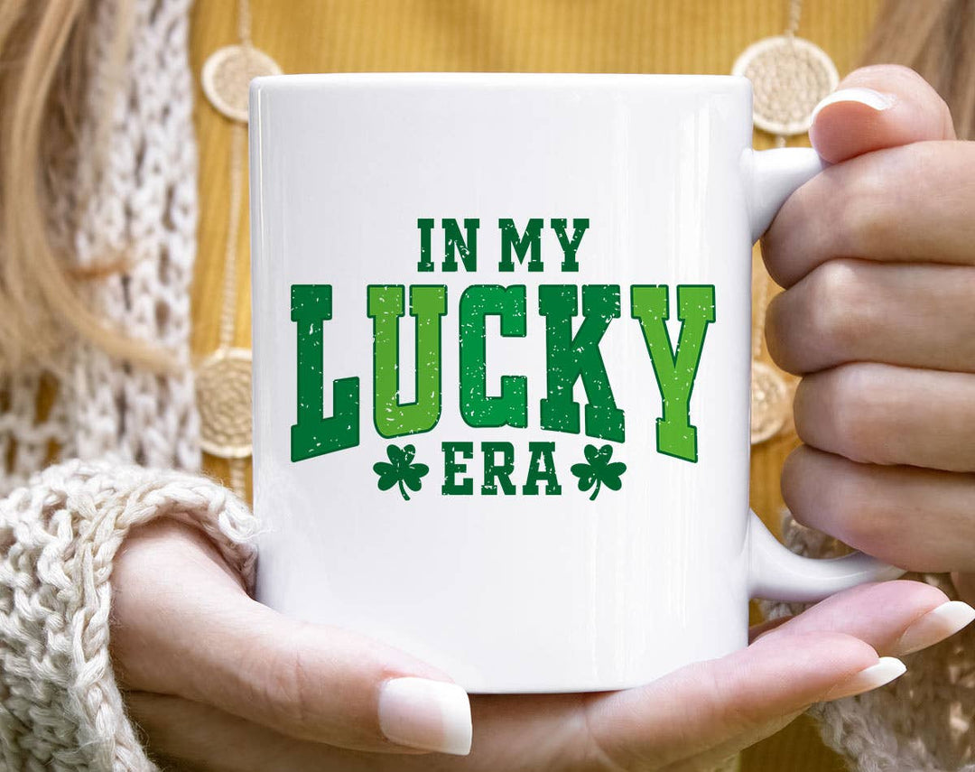 "In My Lucky Era" design on a white ceramic coffee mug