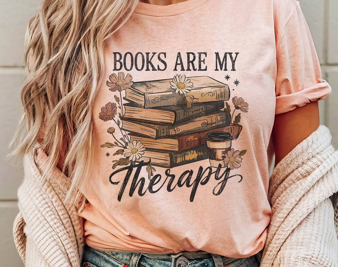 "Books Are My Therapy Flowers" design on a peach unisex t-shirt