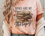 "Books Are My Therapy Flowers" design on a peach unisex t-shirt