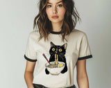 "Cat Eating Ramen" design on a natural ringer t-shirt with black contrast trim