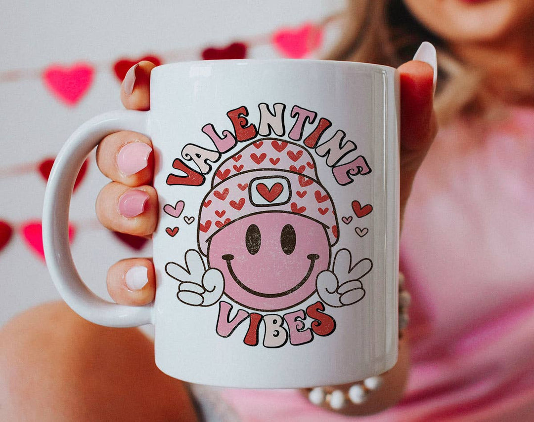 "Valentine Vibes Smiley Peace" design on a white ceramic coffee mug