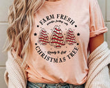 "Farm Fresh Christmas Tree Cakes" design on a peach unisex t-shirt