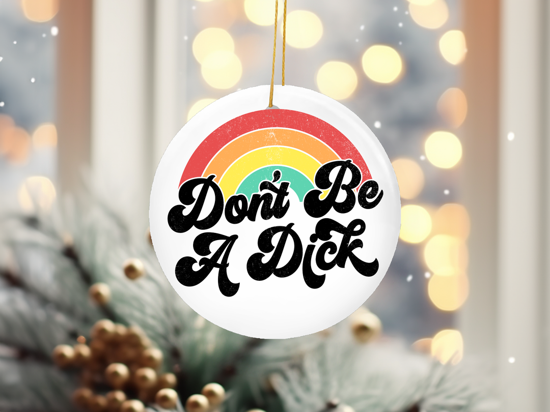 "Don't Be A Dick Rainbow" design on a 2.5 inch round ceramic Christmas ornament