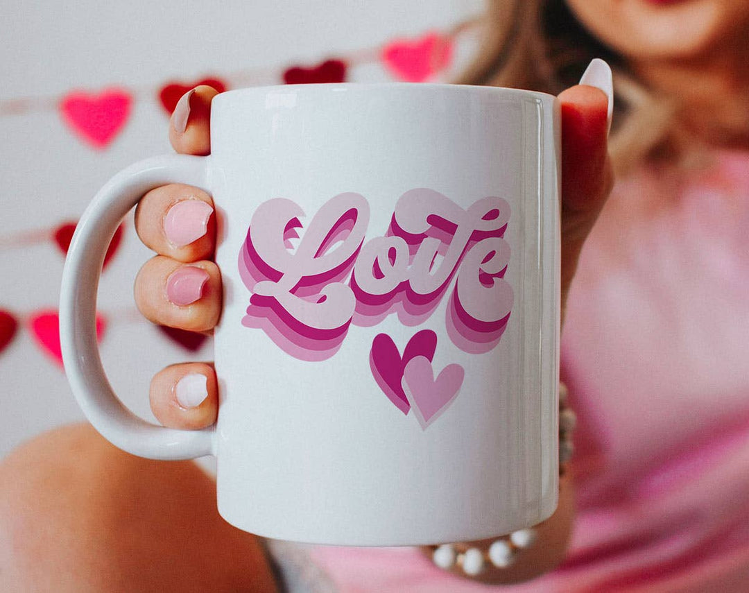 "Love Cursive Hearts" design on a white ceramic coffee mug