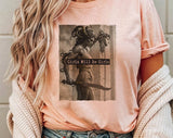 "Girls Will Be Girls Medusa" design on a peach unisex t-shirt
