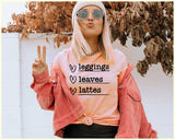 "Leggings Leaves Lattes" design on a peach unisex t-shirt