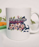 "Massachusetts State Flower Mayflower" design on a white ceramic coffee mug
