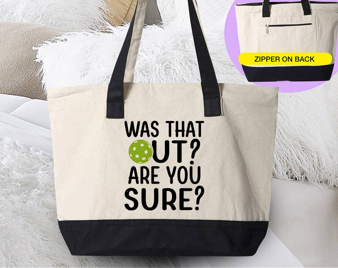 "Was That Out? Are You Sure" design on a natural canvas zippered tote bag