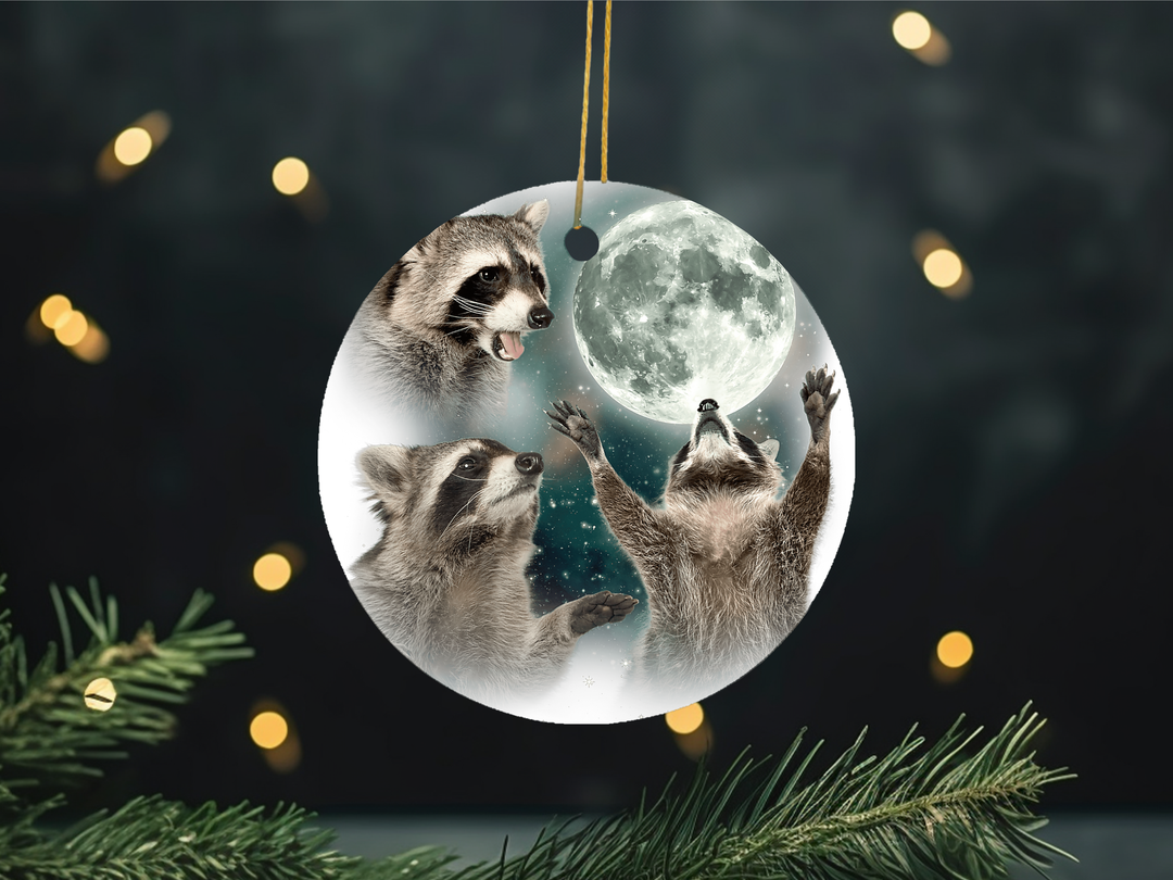 "3 Raccoons Howling At The Moon" design on a 2.5 inch round ceramic Christmas ornament