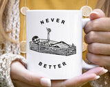 "Never Better Funny Skeleton Coffin" design on a white ceramic coffee mug