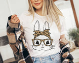 "Easter Bunny Leopard Glasses" design on a peach unisex t-shirt