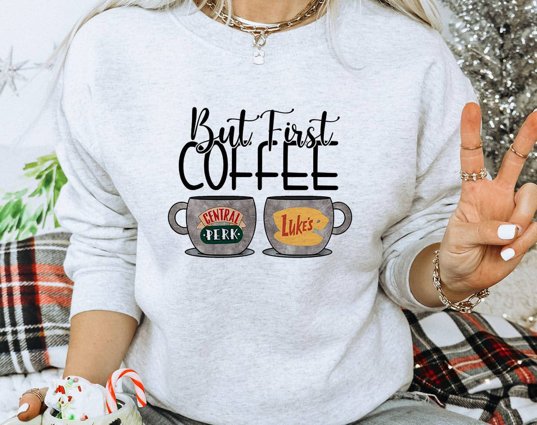 "But First Coffee" design on an ash gray unisex crewneck sweatshirt