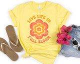 "Live Life In Full Bloom" design on a pale yellow unisex t-shirt