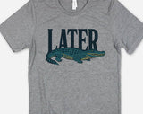 "Later Alligator" design on a heather gray unisex t-shirt