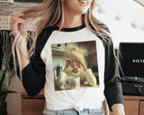 "Doll Face Meme Hot Mess Coffee" design on a white baseball raglan tee with black sleeves