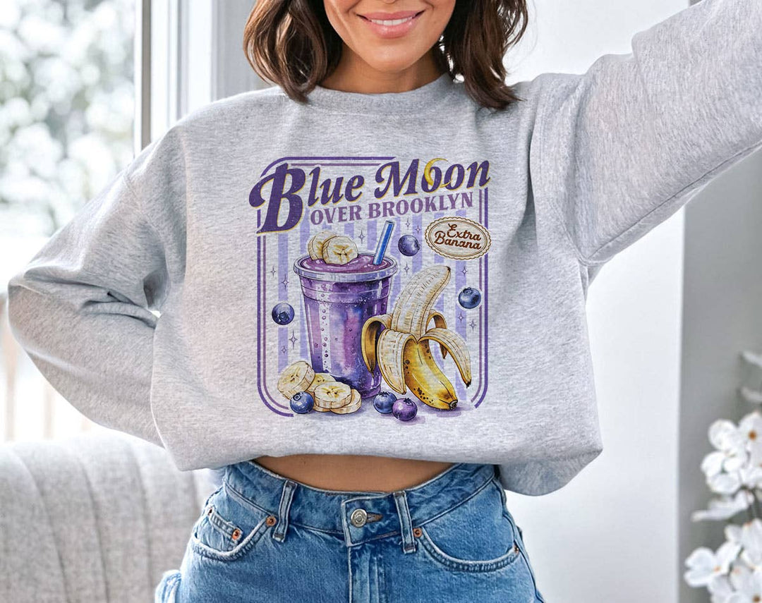 "Blue Moon Over Brooklyn Heated Rivalry" design on an ash gray unisex crewneck sweatshirt