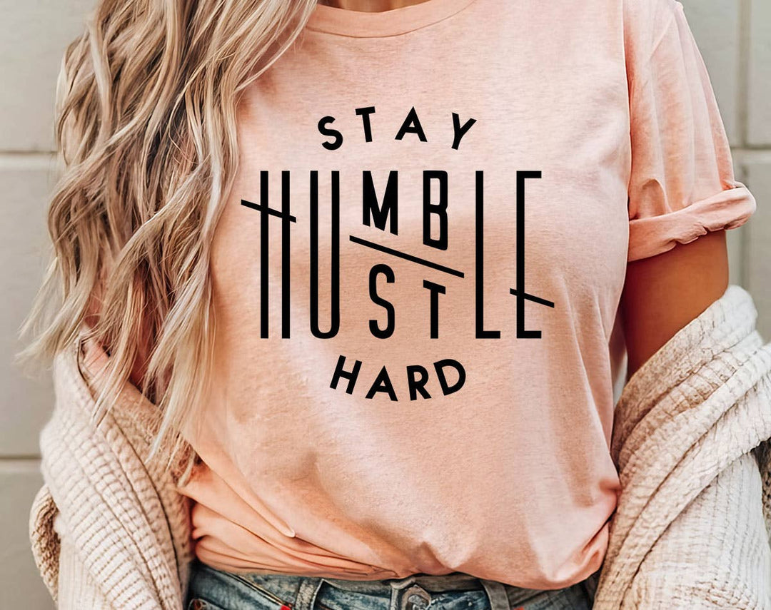 "Stay Humble, Hustle Hard" design on a peach unisex t-shirt