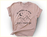 "The Mountains Are Calling" design on a peach unisex t-shirt