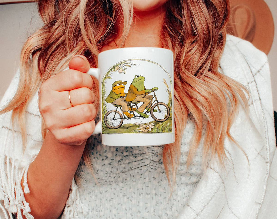 "Frog And Toad" design on a white ceramic coffee mug