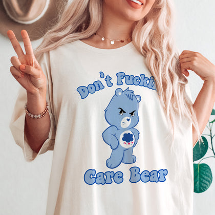 "Don't F-ing Care Bear" design on a natural unisex t-shirt
